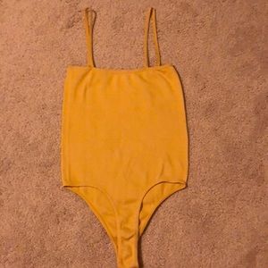 mustard colored body suit from pacsun!!!